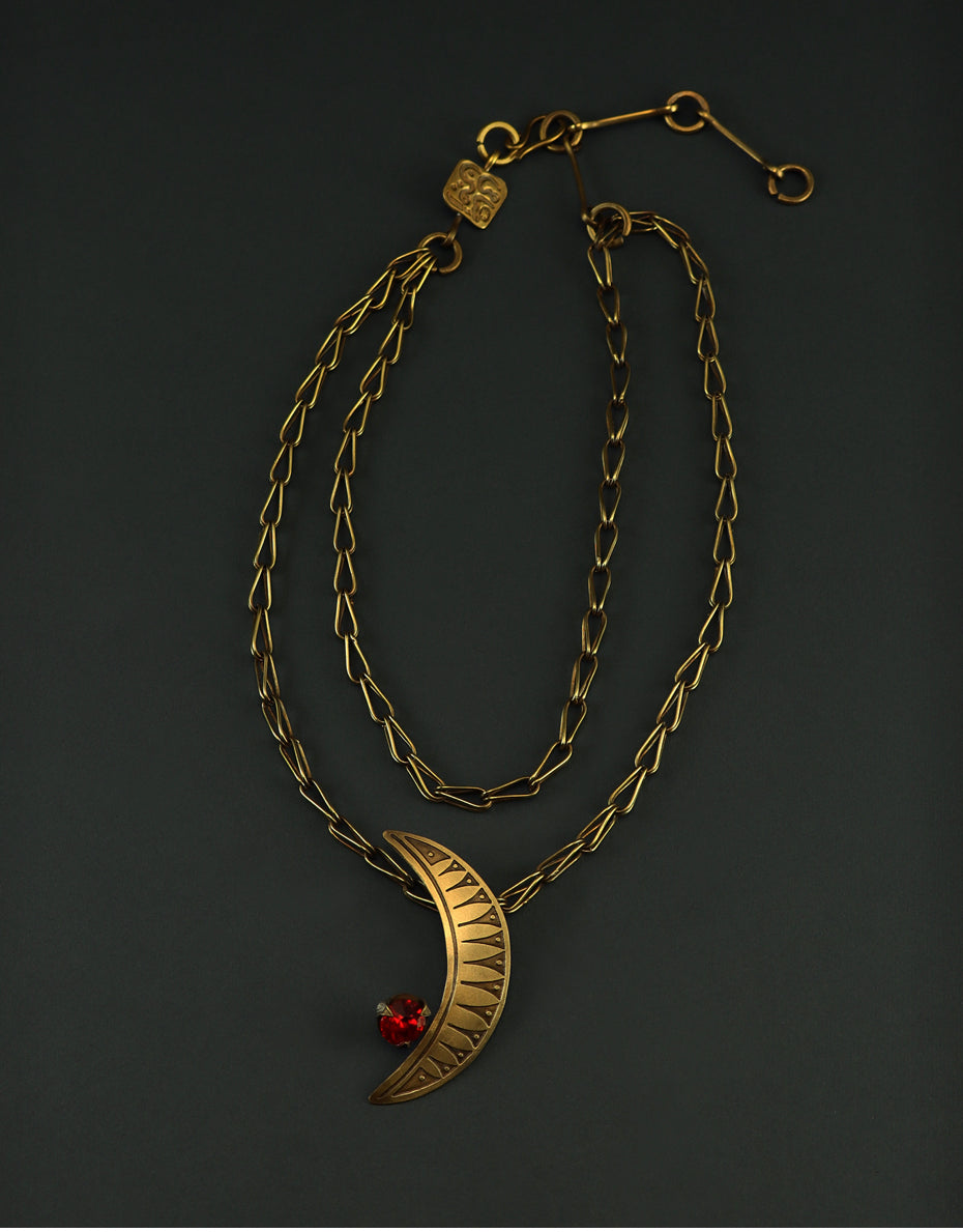 Crescent brass necklace